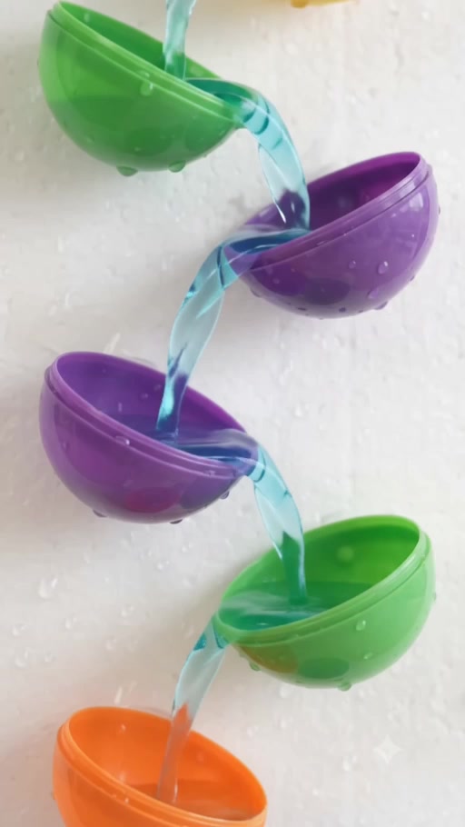 Colourful reusable egg halves arranged as a water wall